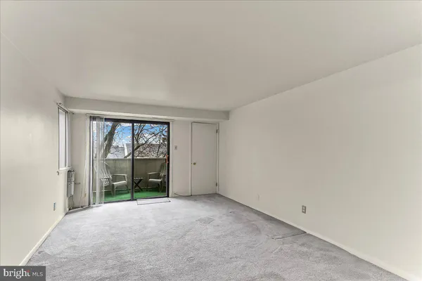 an empty room with large window