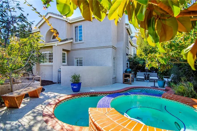 a view of a swimming pool with a patio