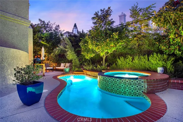 a view of a swimming pool with sitting area