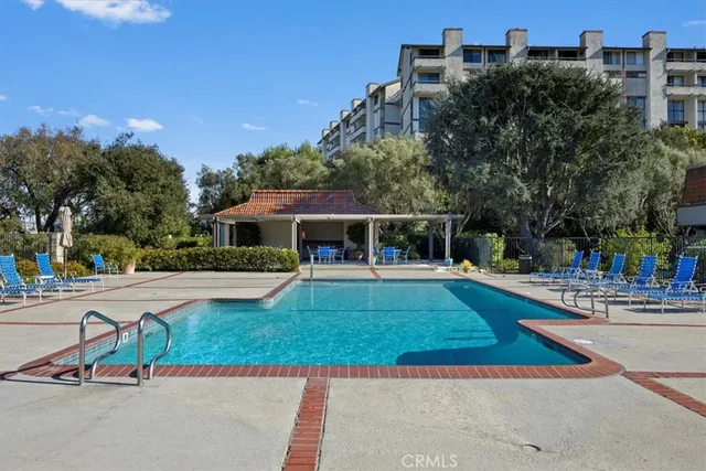 a view of a swimming pool and a yard