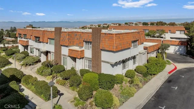 an aerial view of multiple house with a yard