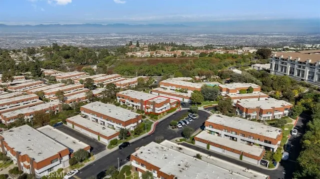 an aerial view of a city with lots of residential buildings