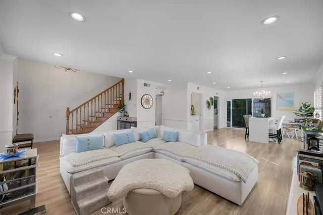 a large white bedroom with furniture