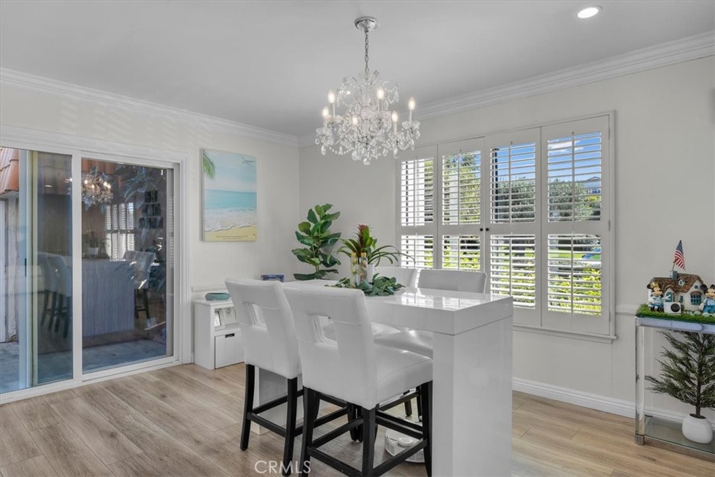 28178 Ridgecove Court South Rancho Palos Verdes, CA 90275 - Photo 8 of 45 a dining room with furniture a chandelier and wooden floor
