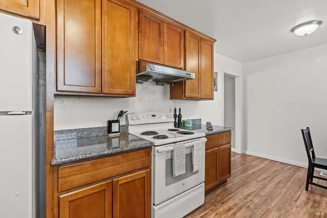 a kitchen with sink cabinets and window