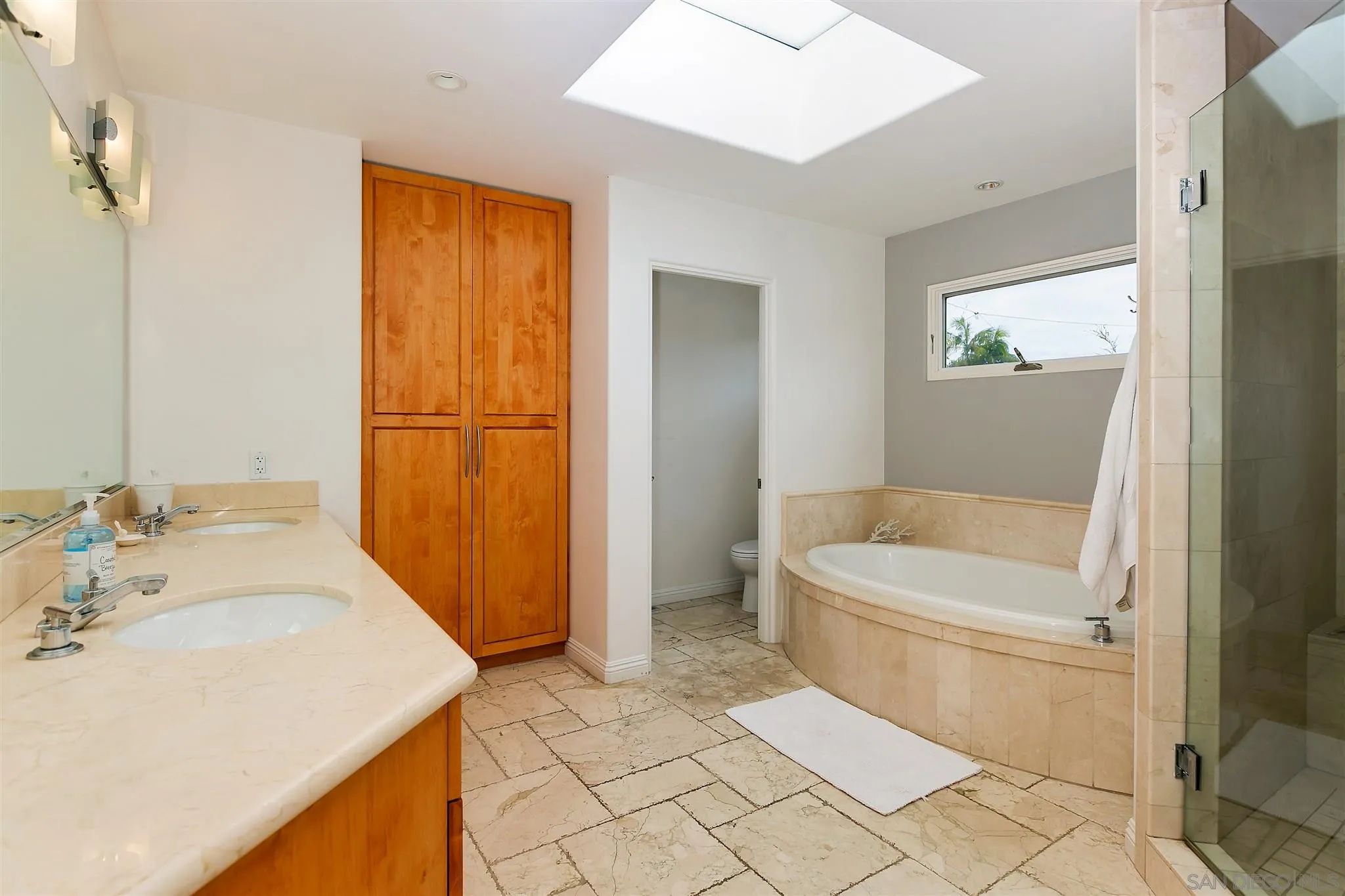 260 23rd Street Del Mar, CA 92014 - Photo 13 of 18 a bathroom with a sink a toilet and shower