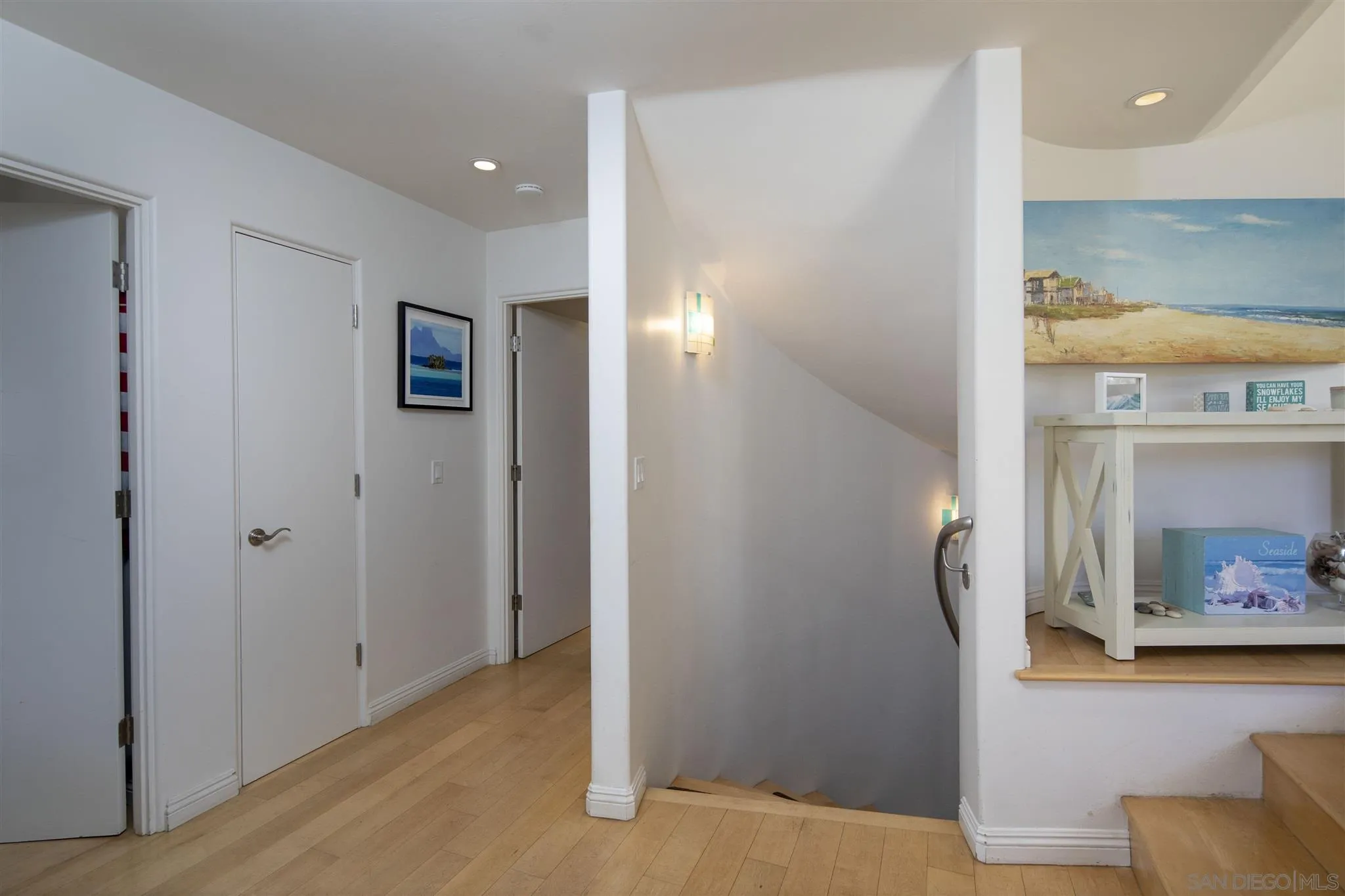260 23rd Street Del Mar, CA 92014 - Photo 14 of 18 a view of a hallway with paintings on the wall