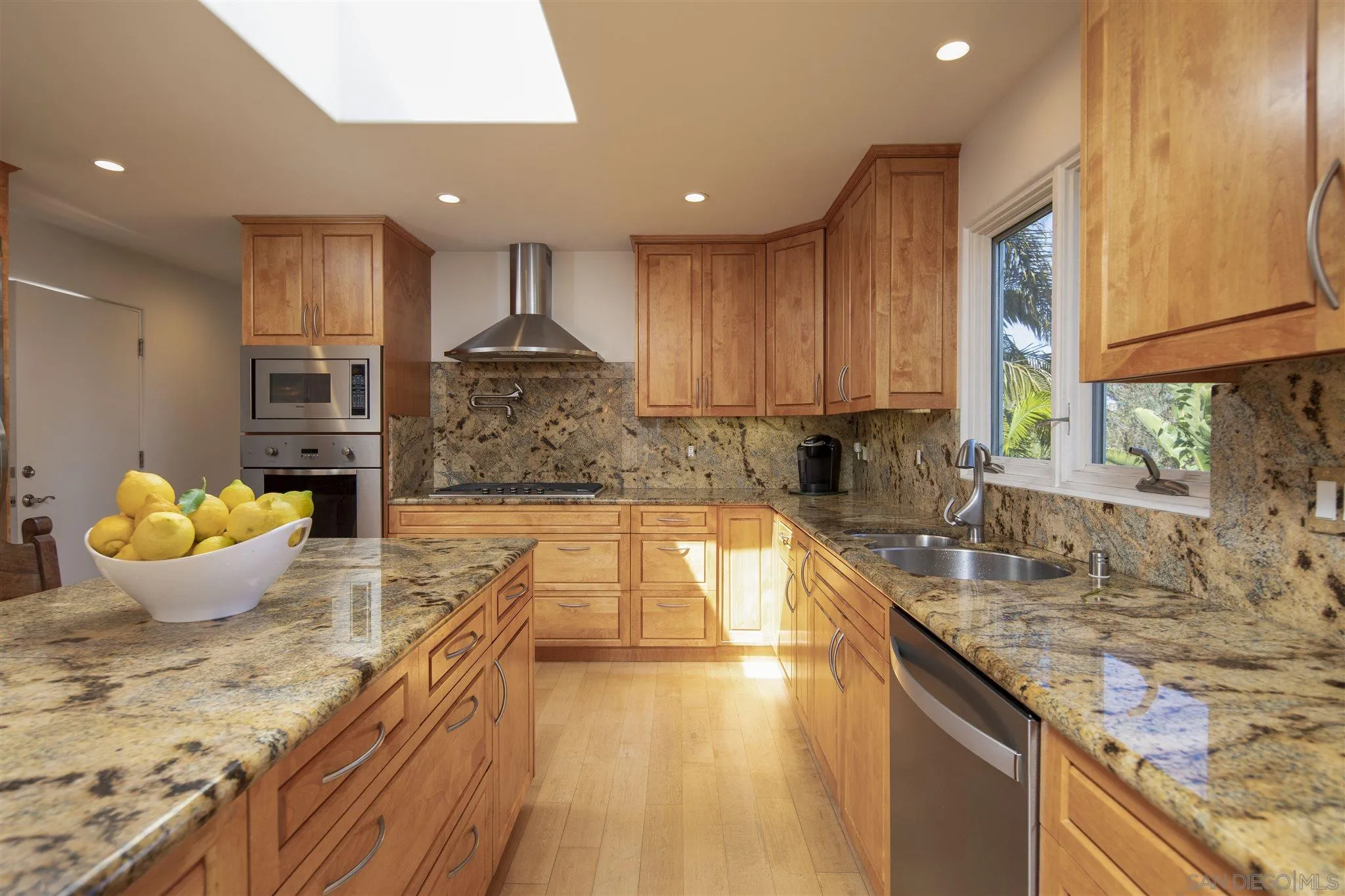 260 23rd Street Del Mar, CA 92014 - Photo 6 of 18 a kitchen with kitchen island granite countertop a sink and a stove