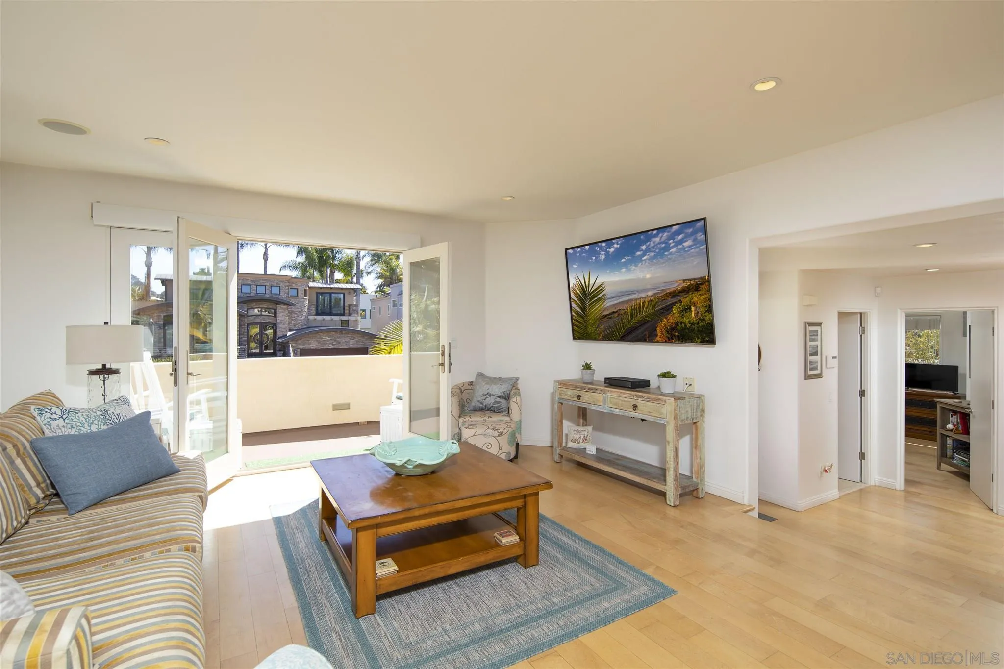 260 23rd Street Del Mar, CA 92014 - Photo 8 of 18 a living room with furniture and a flat screen tv