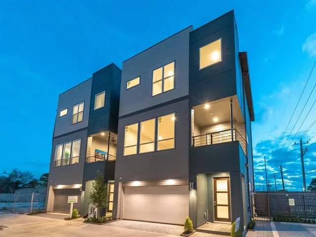 a front view of a building with a yard