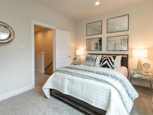 a bedroom with a bed and window