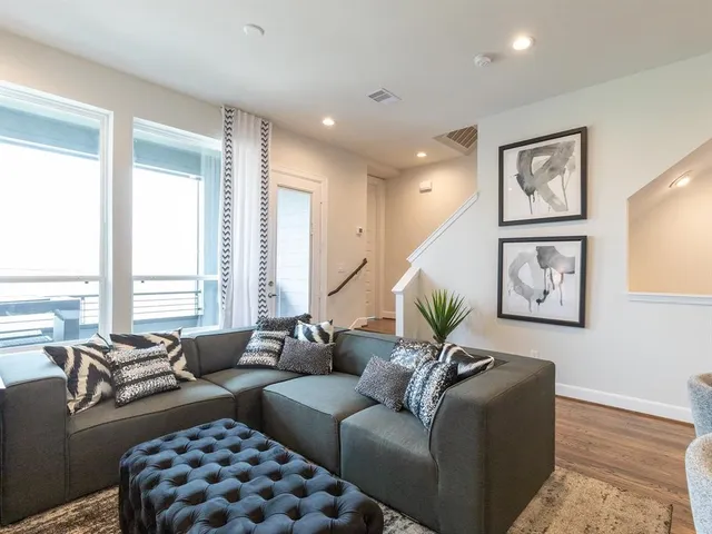 a living room with furniture or couch and a large window