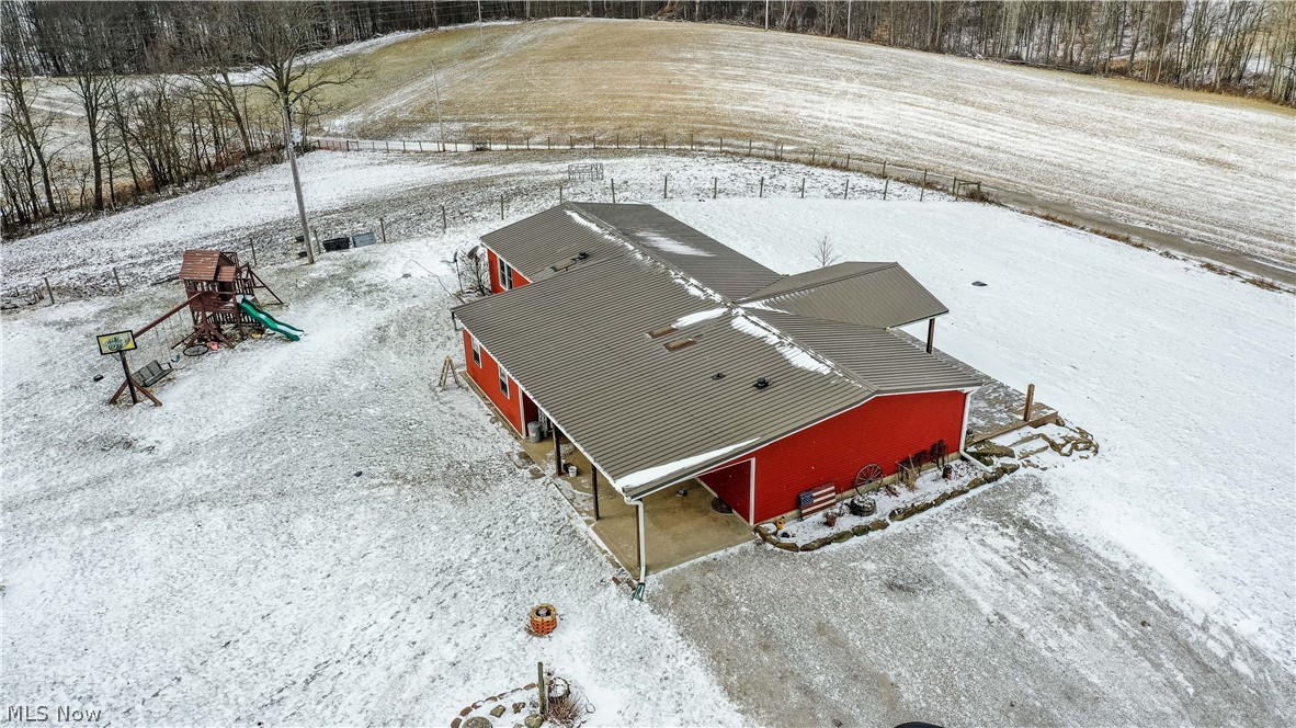 83101 Smith Road Cadiz, OH 43907 - Photo 2 of 35 83101 Smith Rd, Cadiz, OH 43907 is an awesome homesite with beautiful views of the surrounding terrain under 3 miles to Tappan Lake with ranch just under 5 acres of land, 3-4 bedrooms, 2 full baths, family room with wood burning stove, Living Room, mega rear covered patio, huge front deck, with 24x30 horse & hog barn with hay loft & huge 23x30 garage with 2 large overhead doors. Rare opportunity for this updated slice of paradise!