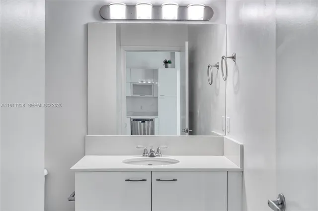 a bathroom with a sink and a mirror