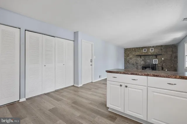 a view of cabinets with wooden floor