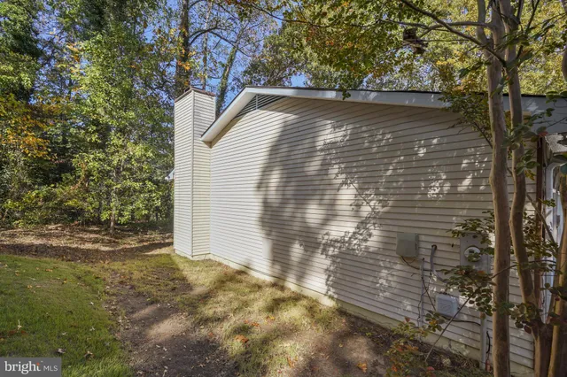a view of a playground with lots of trees and buildings