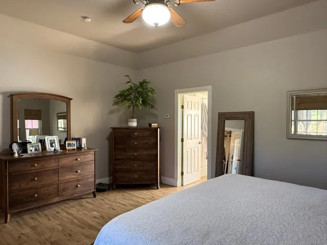 a bedroom with a bed and a dresser
