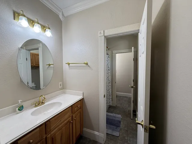 a bathroom with a double vanity sink and a mirror