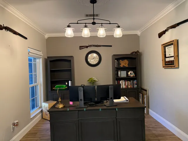 a dining room with table and chairs