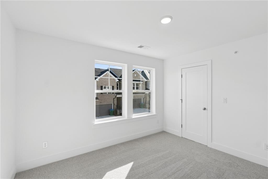 187 Redbud Road Canton, GA 30114 - Photo 12 of 13 a view of an empty room with a window