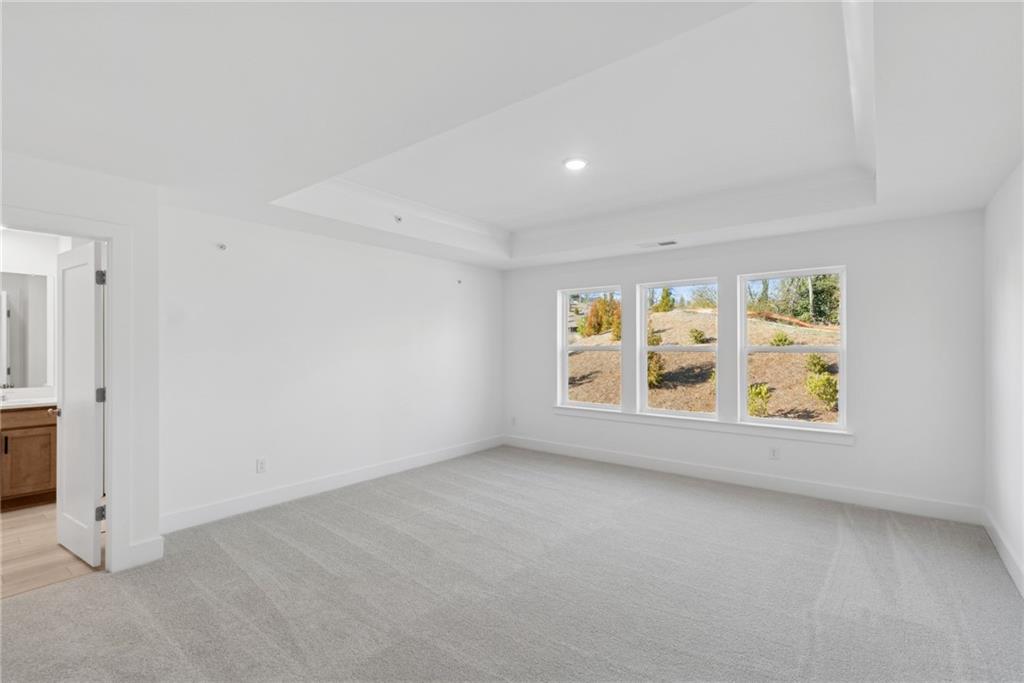 187 Redbud Road Canton, GA 30114 - Photo 8 of 13 an empty room with windows