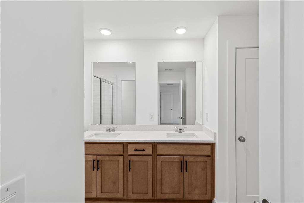 187 Redbud Road Canton, GA 30114 - Photo 10 of 13 a bathroom with a sink and a mirror