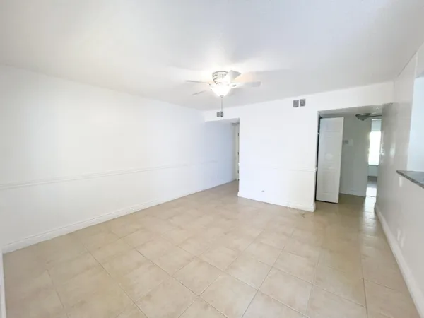 an empty room with a bathroom