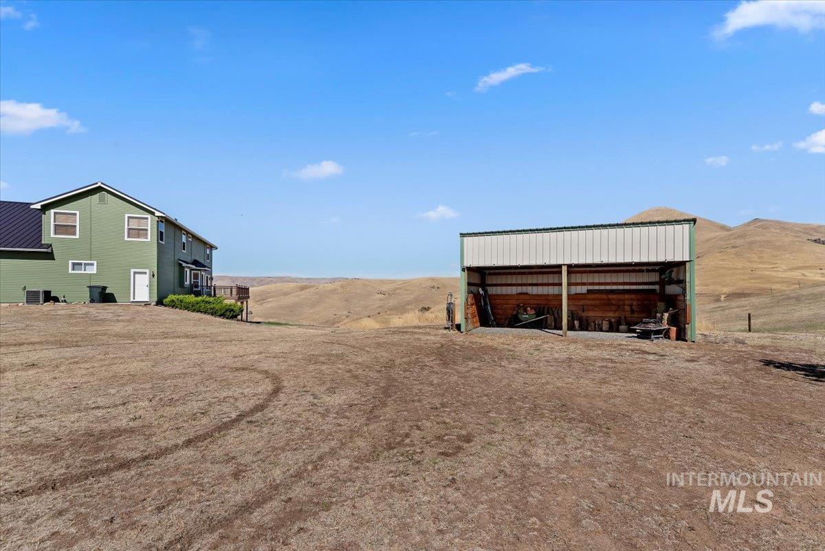 11660 Timber Butte Road Sweet, ID 83670 - Photo 41 of 49 Green-sided residence with multiple windows and a dark roof