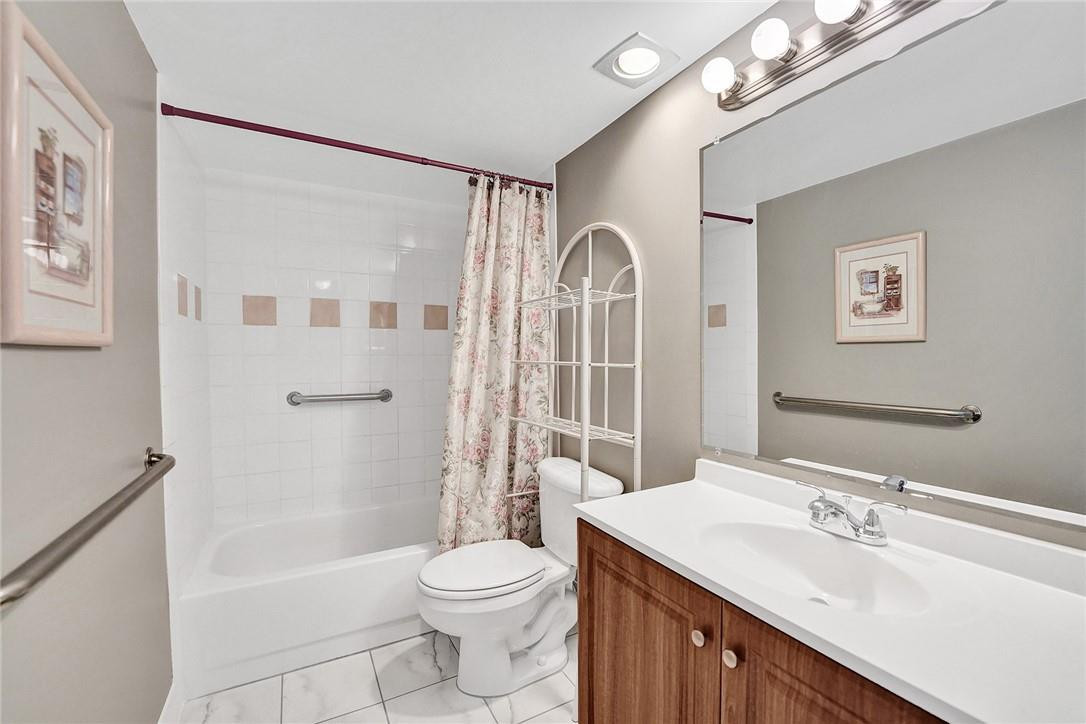 8401 West Sample Road, Unit 37 Coral Springs, FL 33065 - Photo 10 of 22 First floor full bathroom with bathtub.