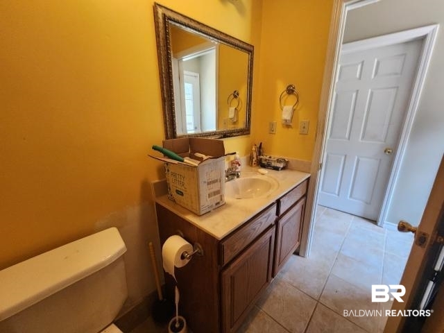 32749 Antietam Road Lillian, AL 36549 - Photo 35 of 47 Bathroom with vanity, toilet, and tile patterned floors