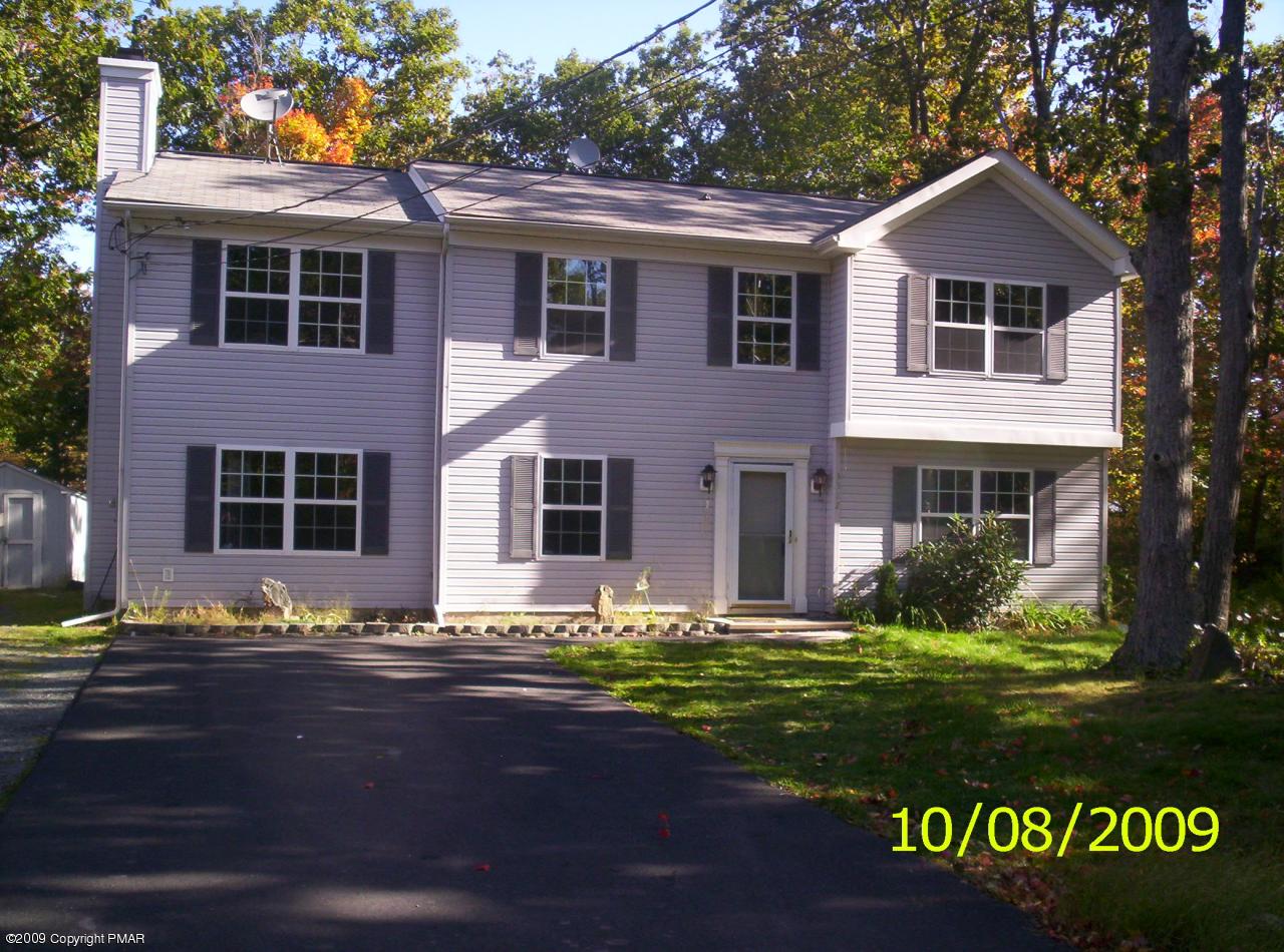 3312 Cotswald Road Tobyhanna, PA 18466 - Photo 1 of 9 a front view of a house with garden