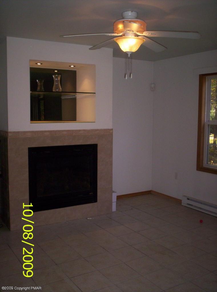 3312 Cotswald Road Tobyhanna, PA 18466 - Photo 4 of 9 a view of a fireplace in a room