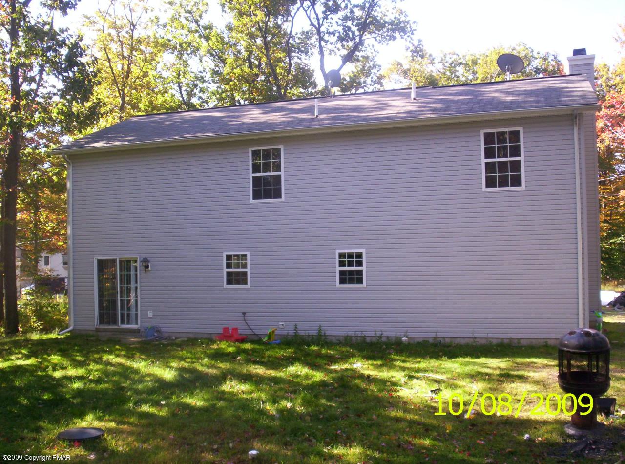 3312 Cotswald Road Tobyhanna, PA 18466 - Photo 7 of 9 a backyard of a house with yard table and chairs