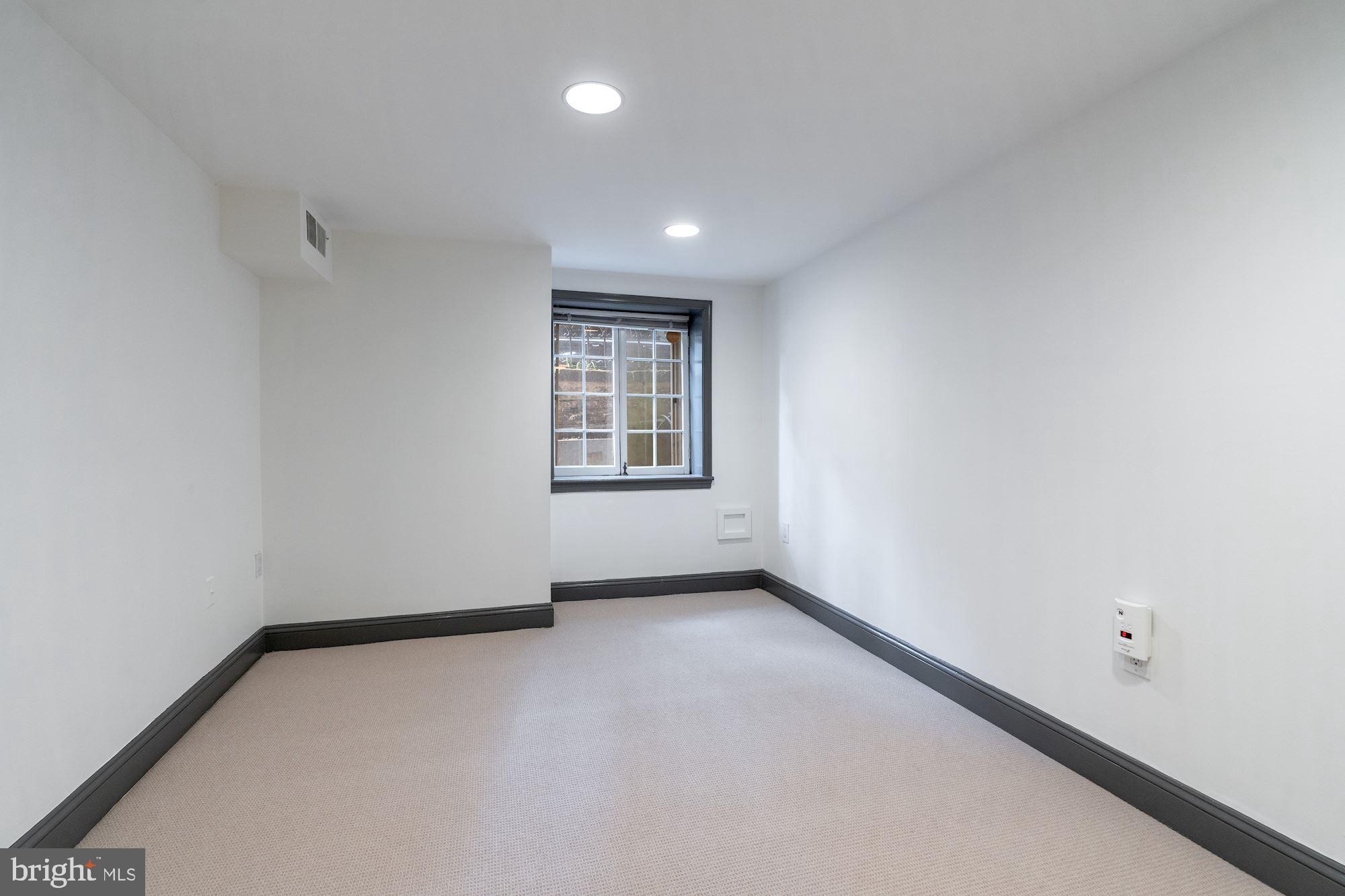 3267 N Street Northwest, Unit 2 Washington, DC 20007 - Photo 17 of 21 an empty room with windows