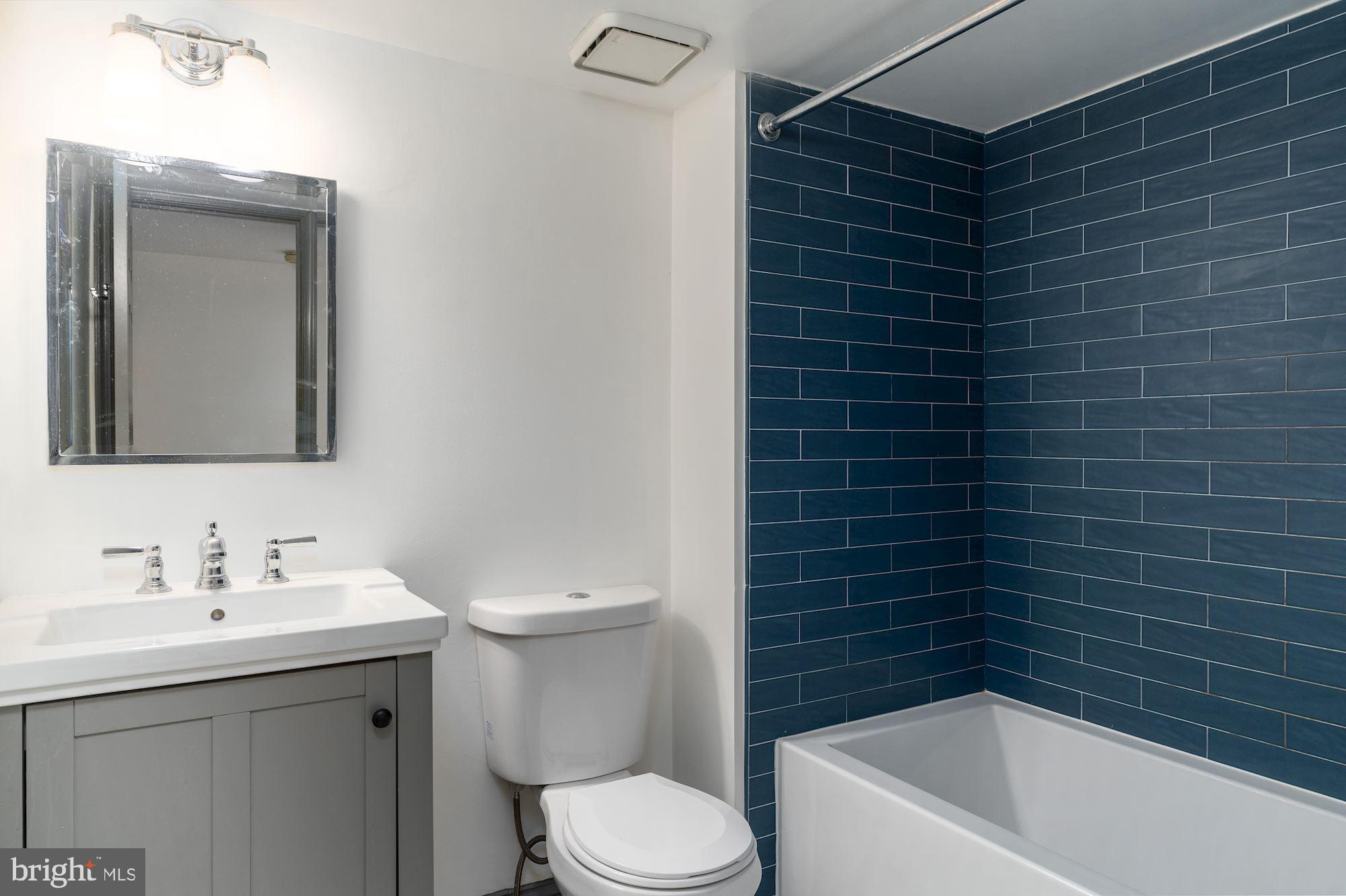 3267 N Street Northwest, Unit 2 Washington, DC 20007 - Photo 19 of 21 a bathroom with a sink toilet and shower