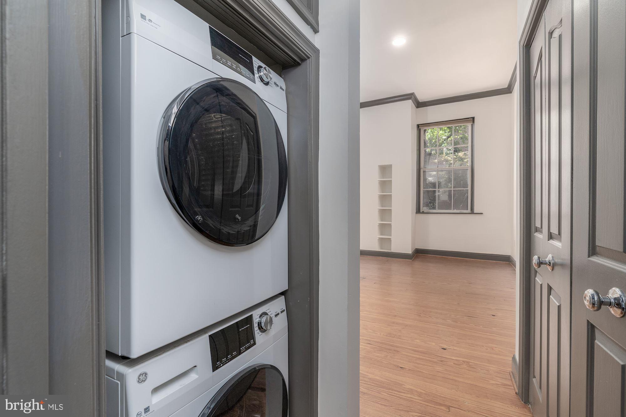 3267 N Street Northwest, Unit 2 Washington, DC 20007 - Photo 20 of 21 a view of a hallway with washer and dryer