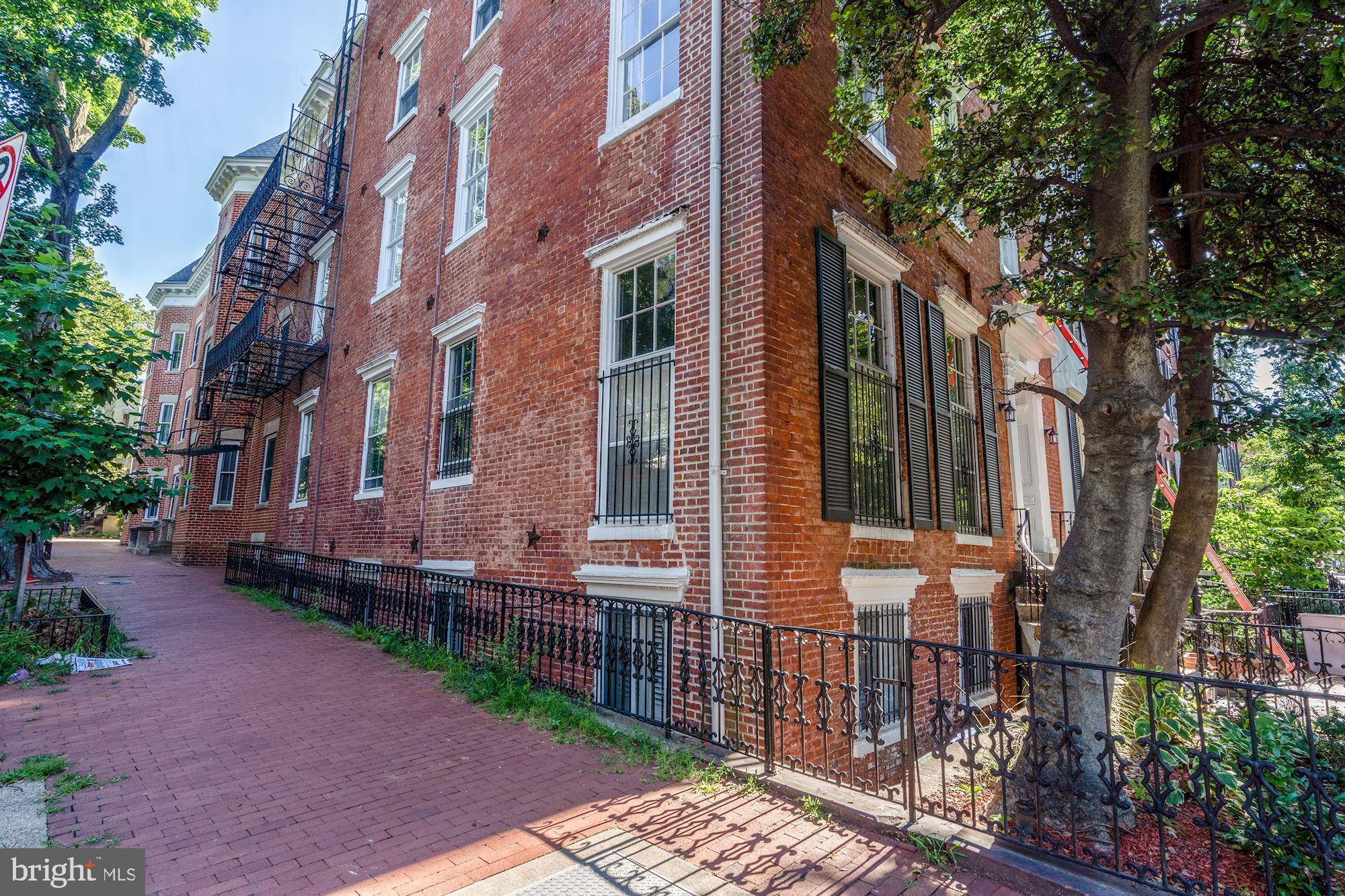 3267 N Street Northwest, Unit 2 Washington, DC 20007 - Photo 21 of 21 a view of a brick building next to a yard