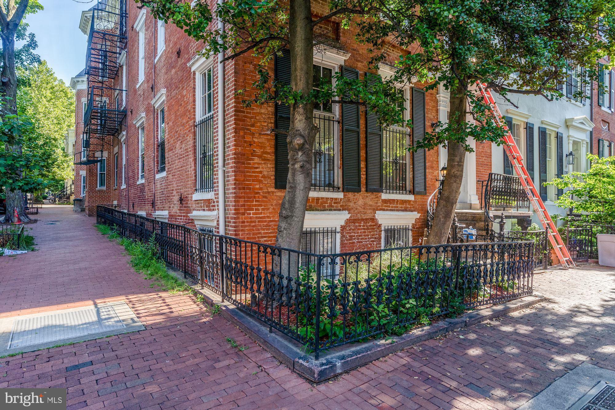 3267 N Street Northwest, Unit 2 Washington, DC 20007 - Photo 3 of 21 a view of a garden with large trees