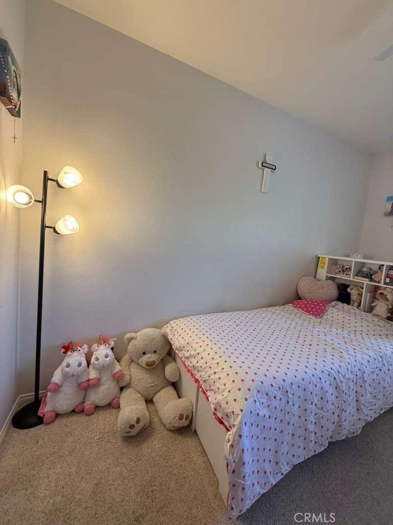 2931 Esperanza Way, Unit B Simi Valley, CA 93063 - Photo 41 of 49 a bedroom with a bed and a night stand