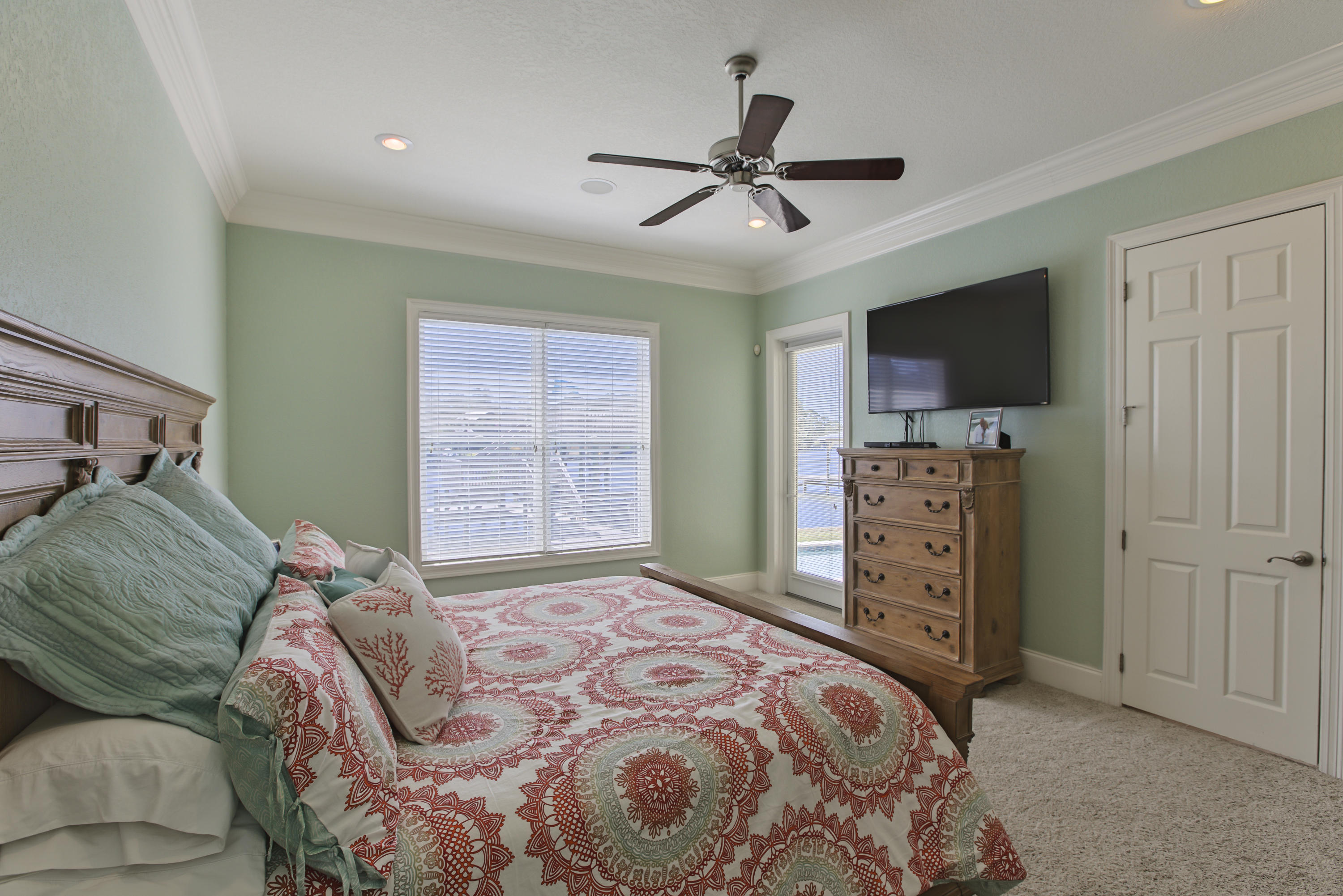 218 Buck Road Santa Rosa Beach, FL 32459 - Photo 11 of 25 a bedroom with a bed and a television