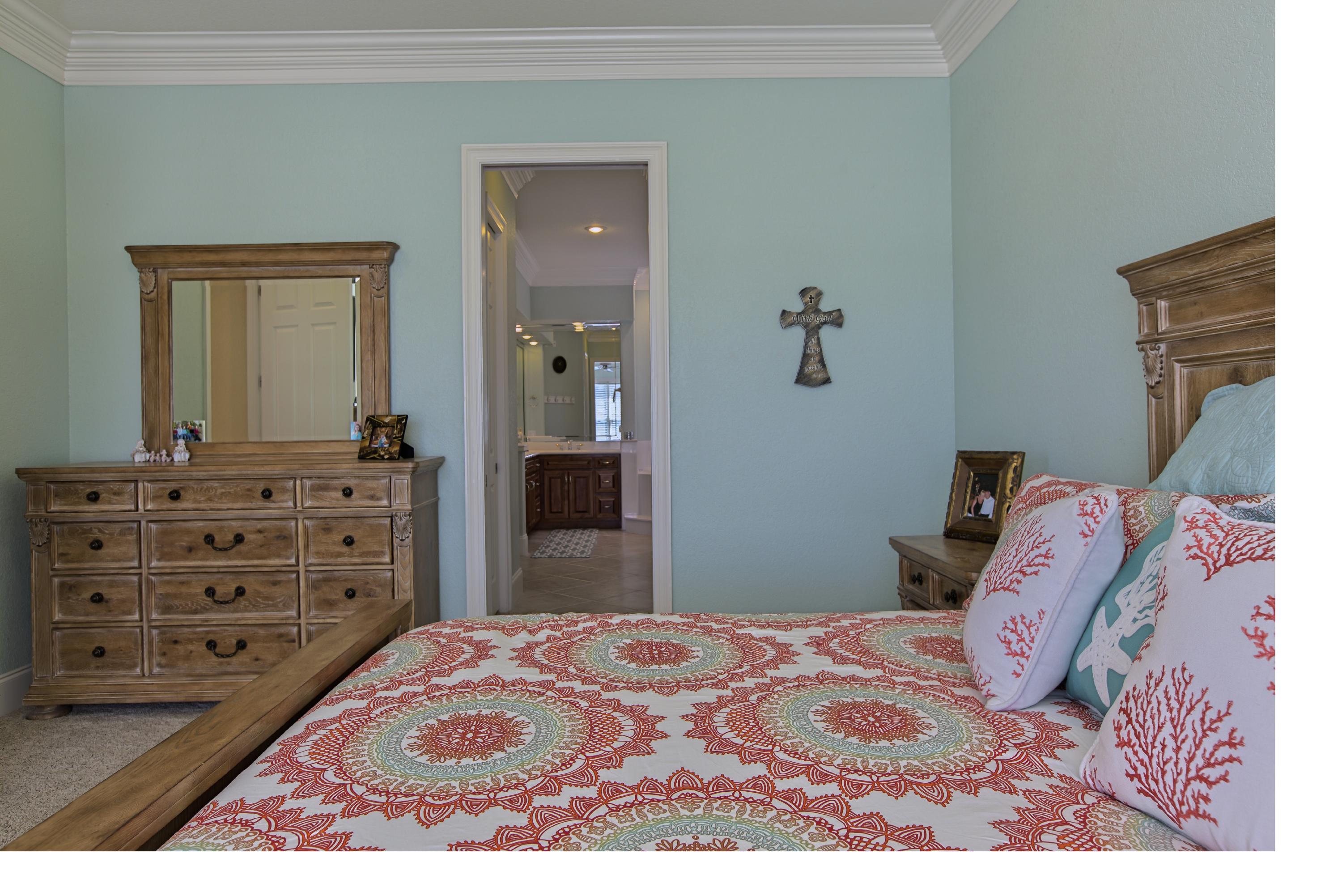 218 Buck Road Santa Rosa Beach, FL 32459 - Photo 12 of 25 a bedroom with a bed and a dresser