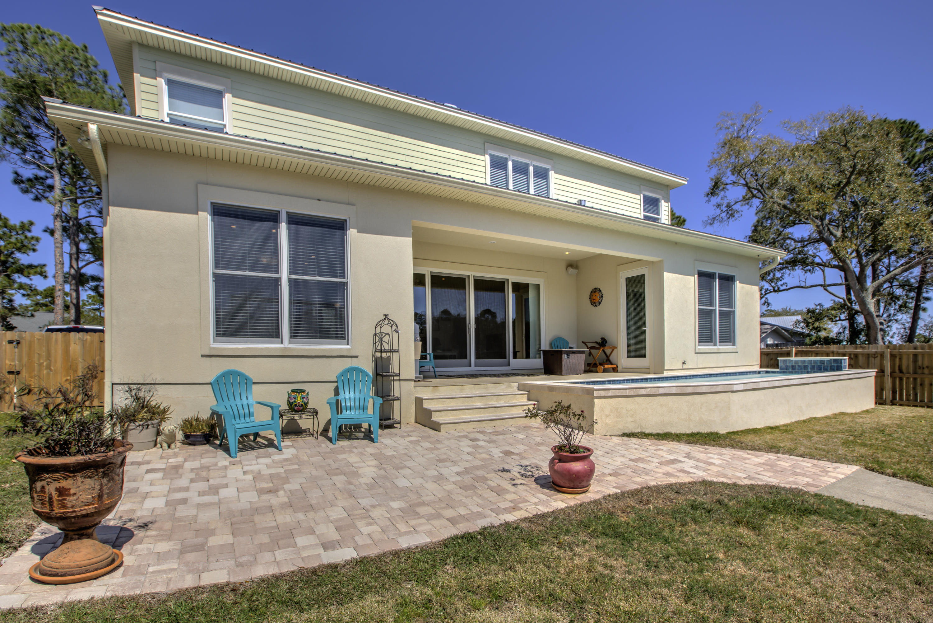 218 Buck Road Santa Rosa Beach, FL 32459 - Photo 14 of 25 a view of a house with backyard and sitting area