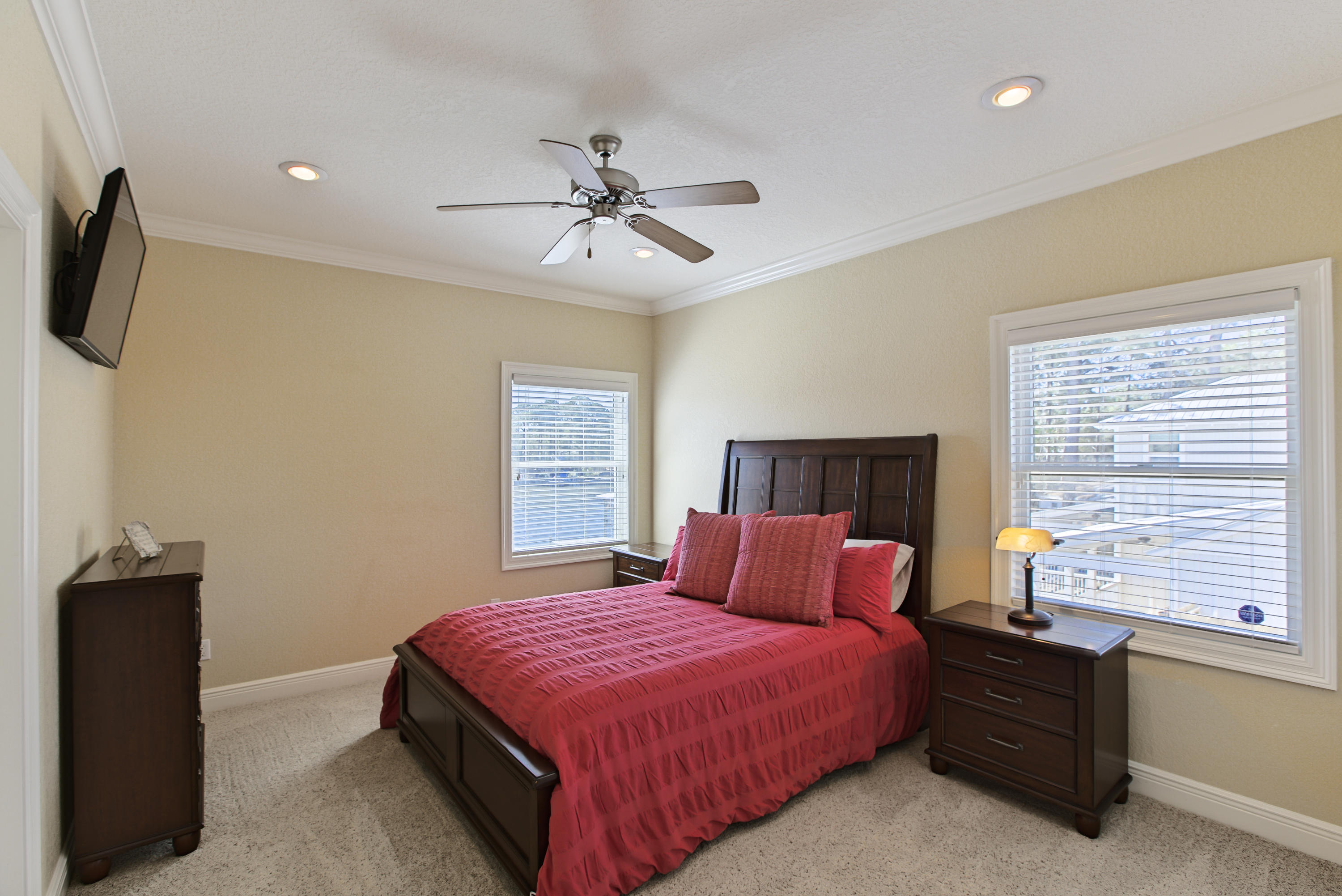 218 Buck Road Santa Rosa Beach, FL 32459 - Photo 18 of 25 a bedroom with a large bed and a flat tv screen