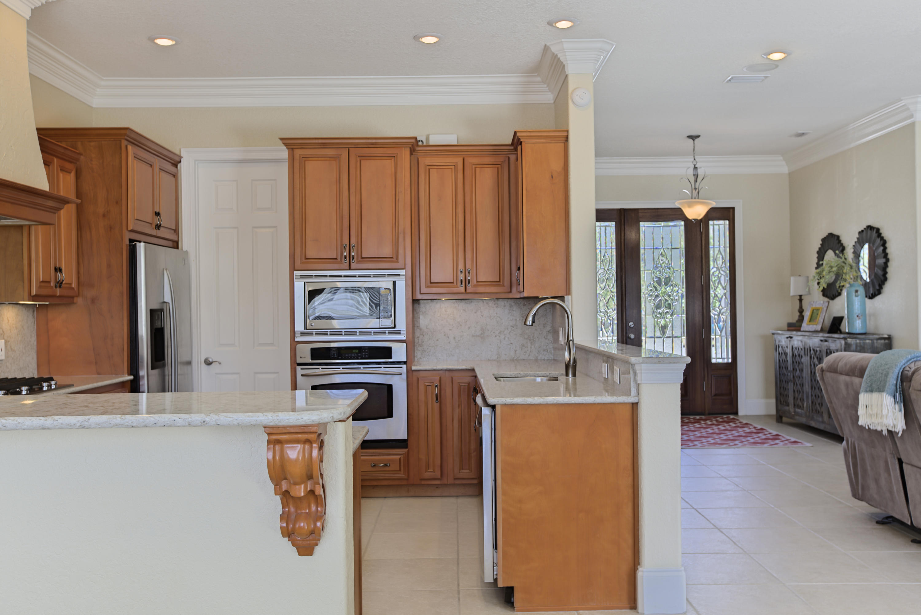 218 Buck Road Santa Rosa Beach, FL 32459 - Photo 22 of 25 a kitchen with stainless steel appliances granite countertop a refrigerator a stove top oven a sink and dishwasher