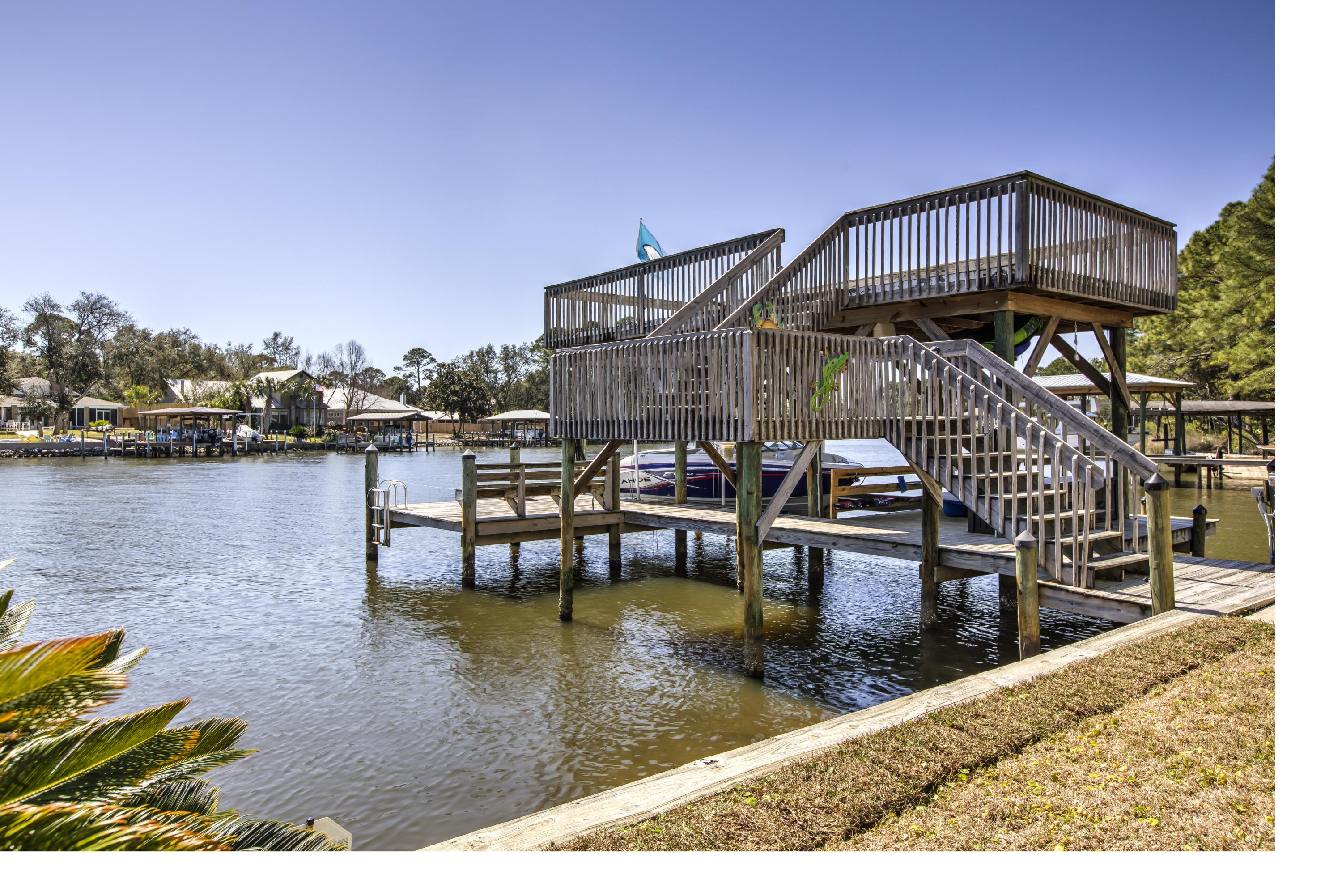 218 Buck Road Santa Rosa Beach, FL 32459 - Photo 23 of 25 a view of a swimming pool with outdoor seating