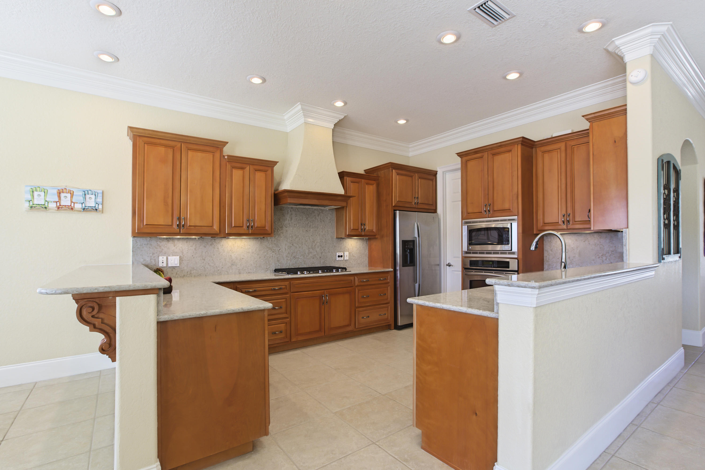218 Buck Road Santa Rosa Beach, FL 32459 - Photo 8 of 25 a kitchen with stainless steel appliances granite countertop a sink stove refrigerator and cabinets