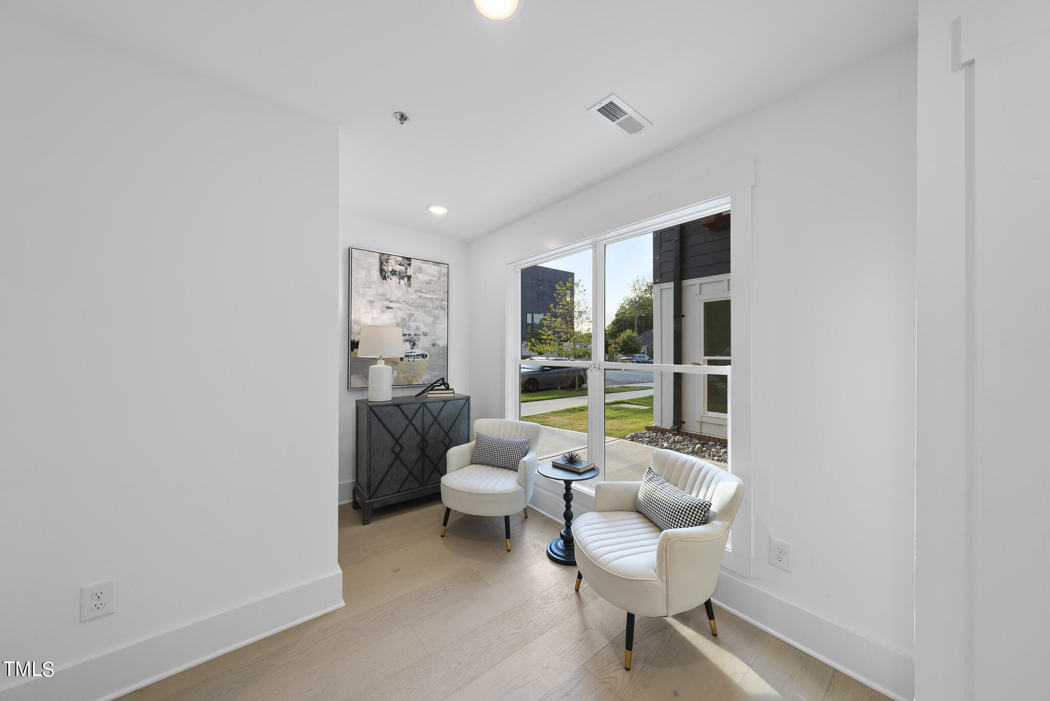 2 Seawell Avenue, Unit 105 Raleigh, NC 27601 - Photo 12 of 40 a living room with furniture and a large window