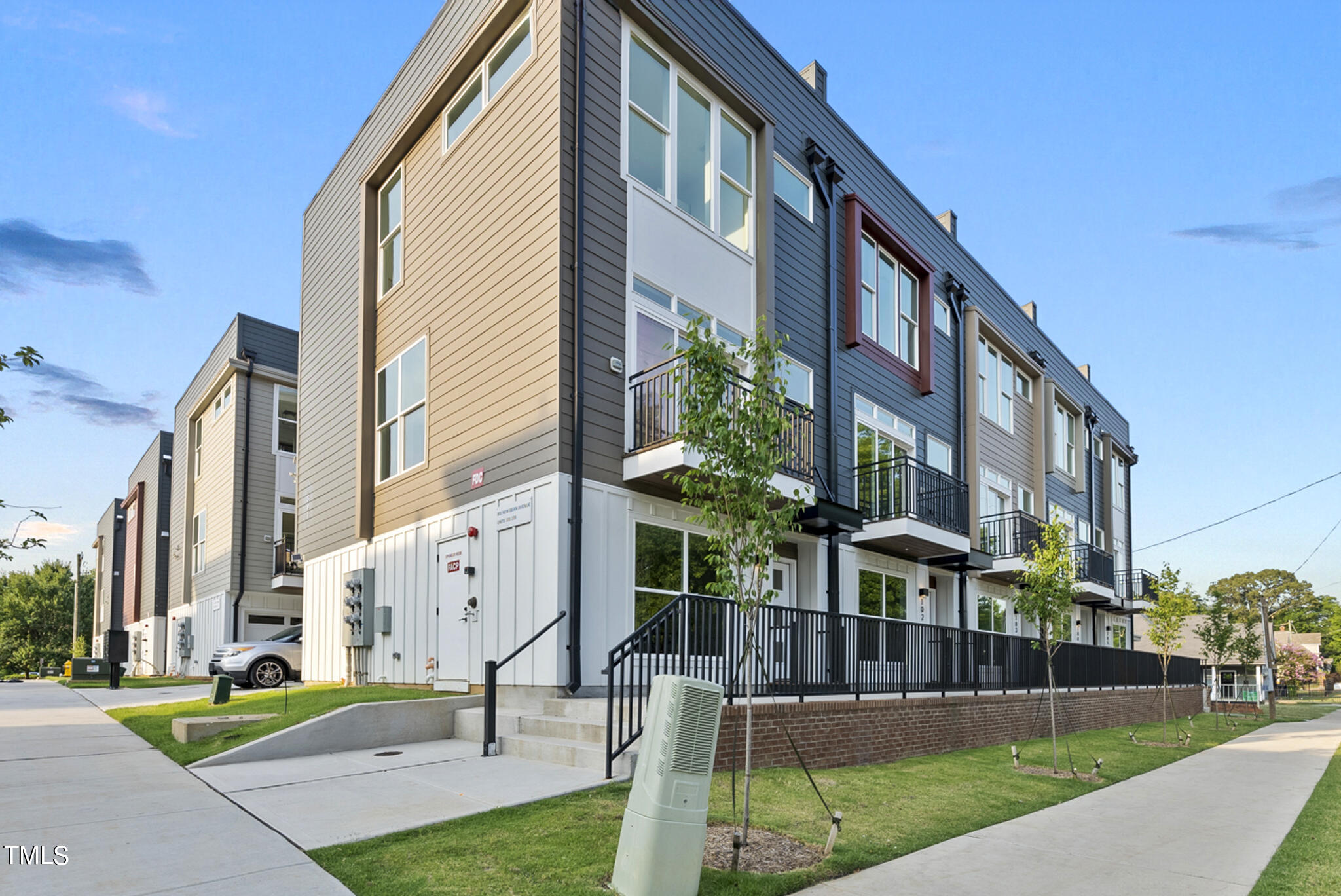 2 Seawell Avenue, Unit 105 Raleigh, NC 27601 - Photo 23 of 40 a view of a building with a yard