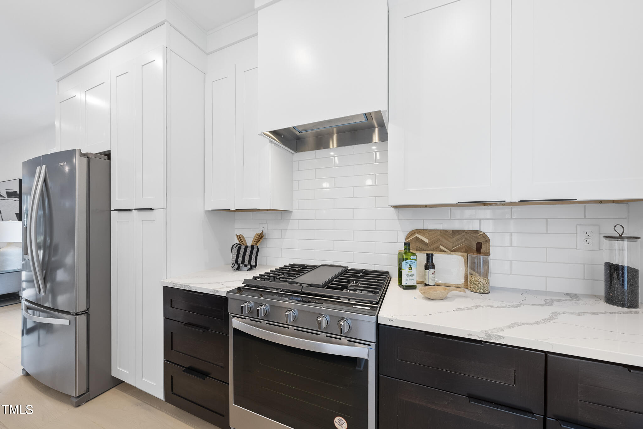 2 Seawell Avenue, Unit 105 Raleigh, NC 27601 - Photo 4 of 40 a kitchen with a sink stainless steel appliances and cabinets