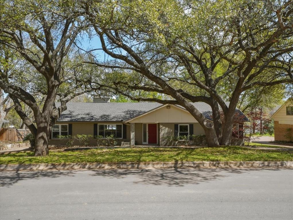3863 Clayton Road East Fort Worth, TX 76116 - Photo 1 of 39 a front view of a house with a garden